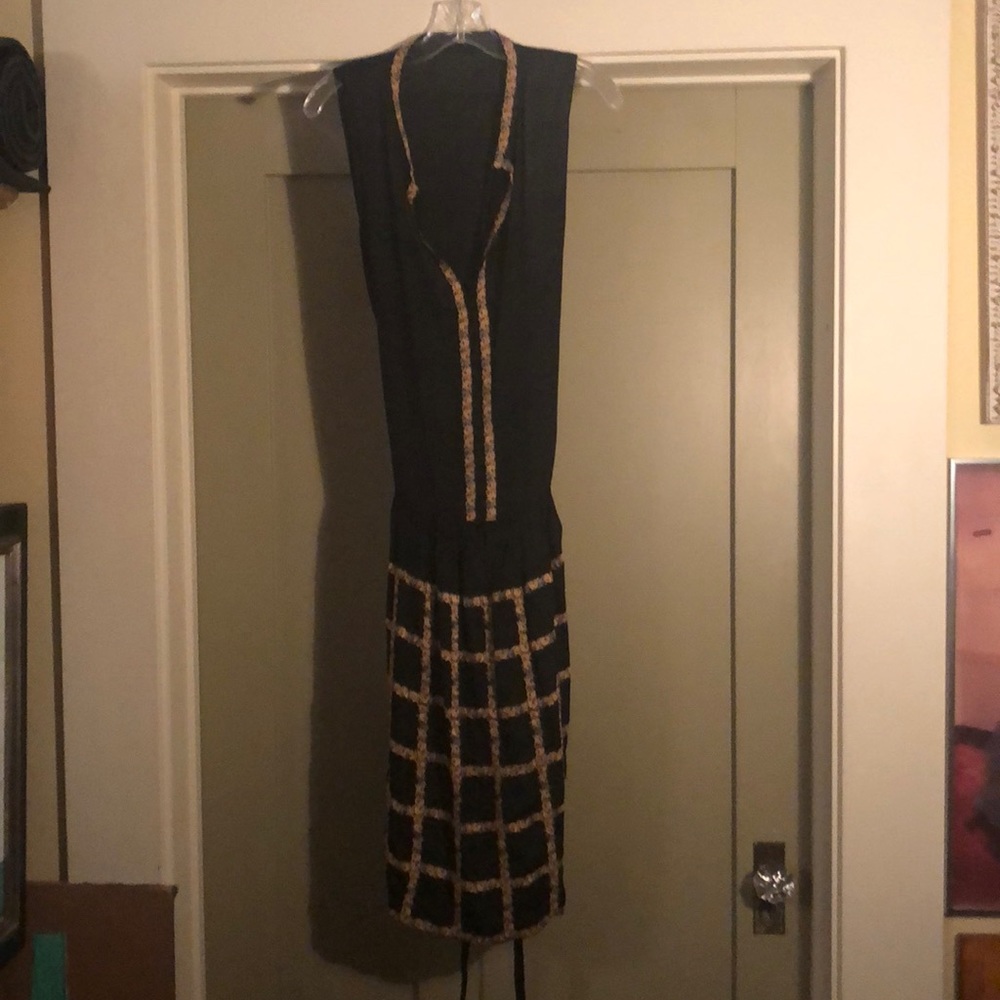 Black dress with gold pattern trim